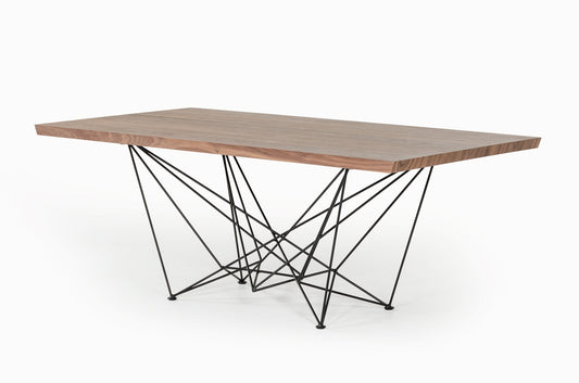 Modern dining table with wooden top and geometric metal legs on a white background