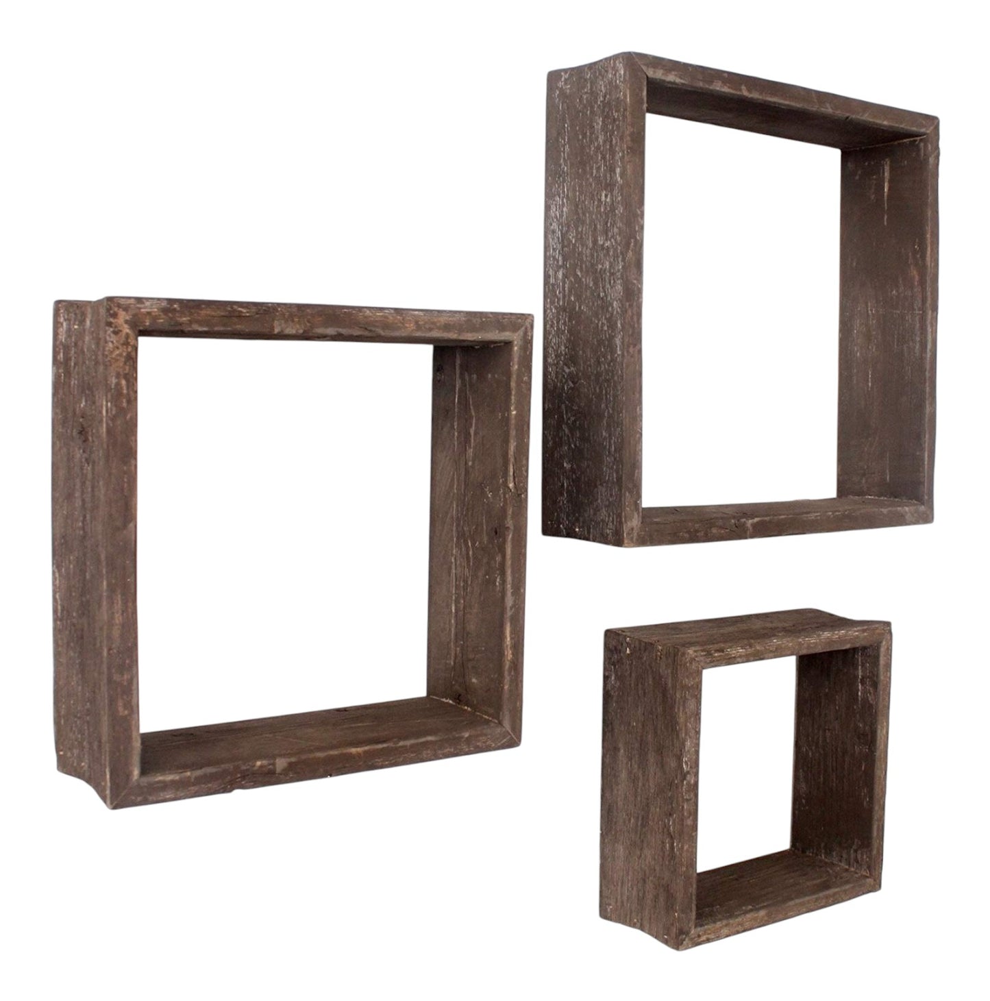 Set of three wooden square shelves on a white background