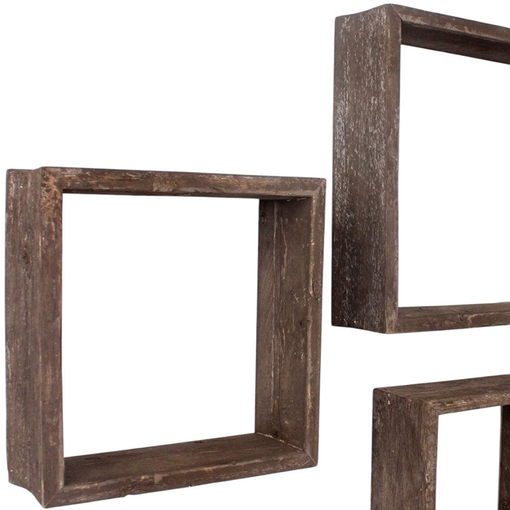 Set of three wooden shelves with a rustic finish on a white background