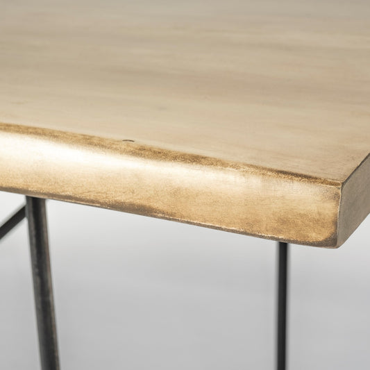 Close-up of a wooden desk with a metal frame on a light gray background