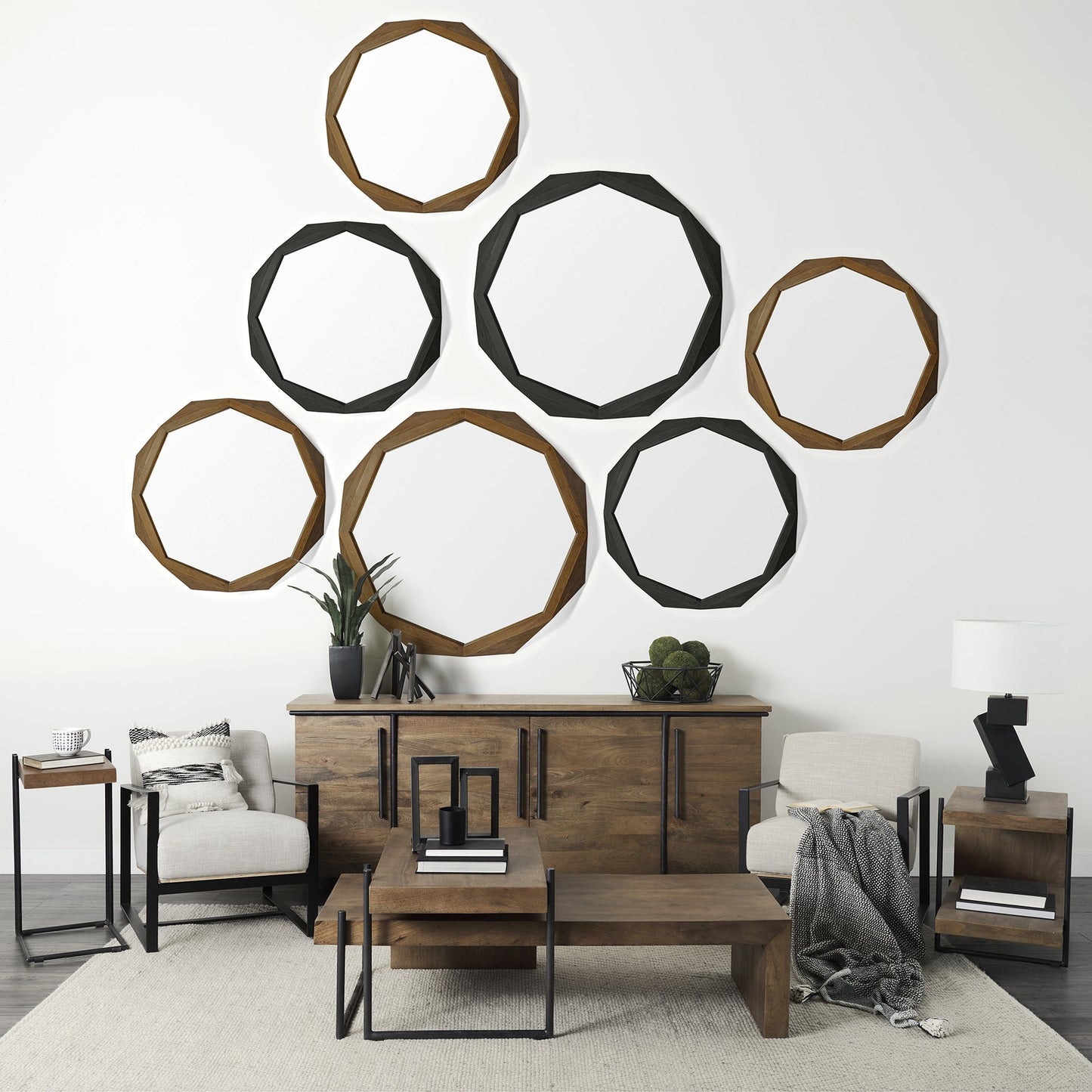 Modern living room with wooden furniture and decorative mirrors on the wall.