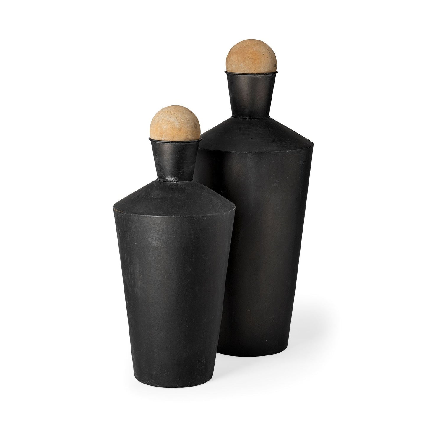 Two black cylindrical vases with wooden tops on a white background