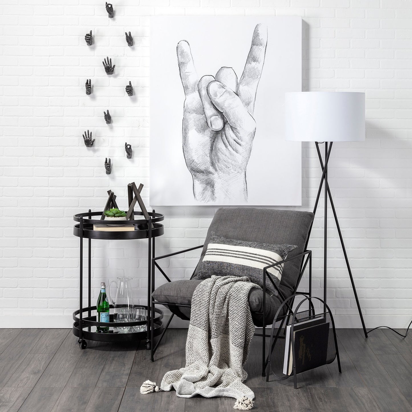 Modern interior with a chair, table, and decorative elements against a white brick wall.