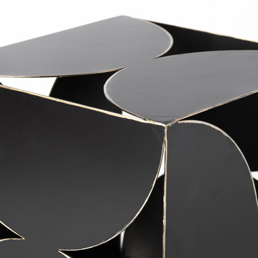 Black and silver geometric table with reflective surface