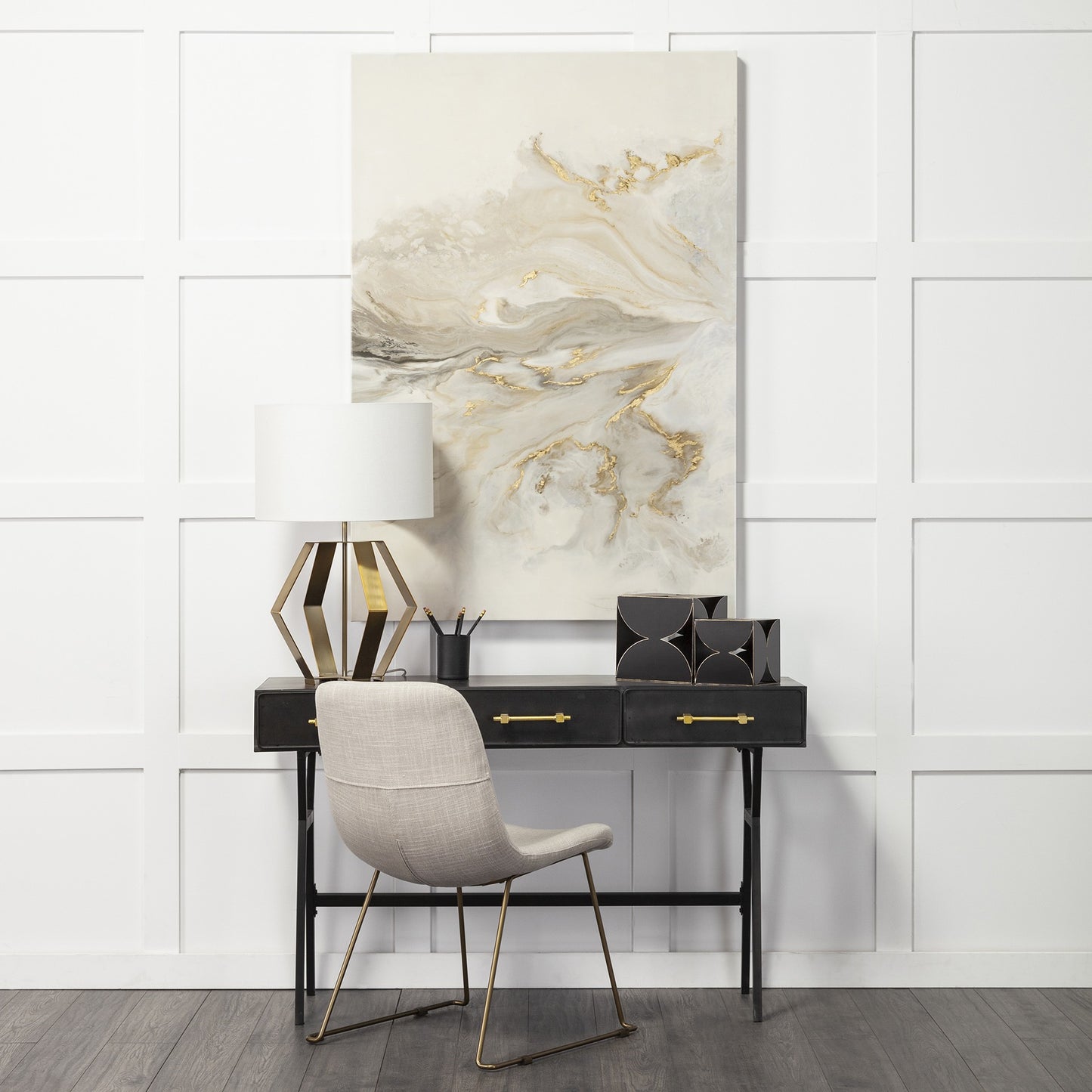 Modern interior design with a black desk, gray chair, and abstract painting on a paneled wall.