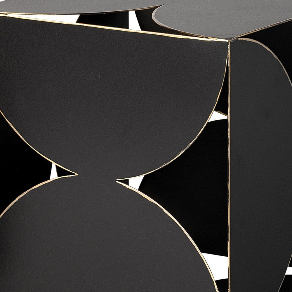 Black geometric side table with gold accents