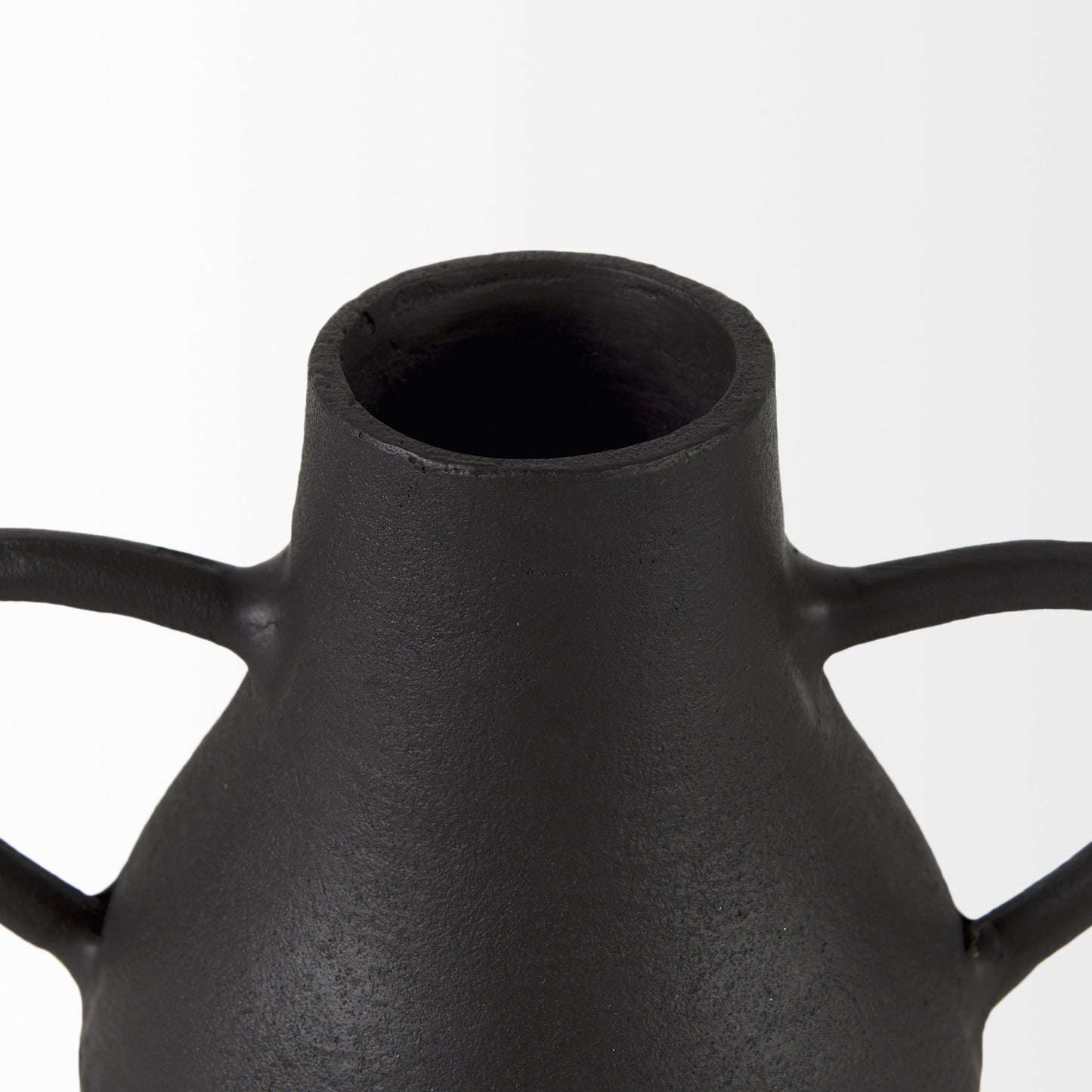 Black ceramic vase with two handles on a white background