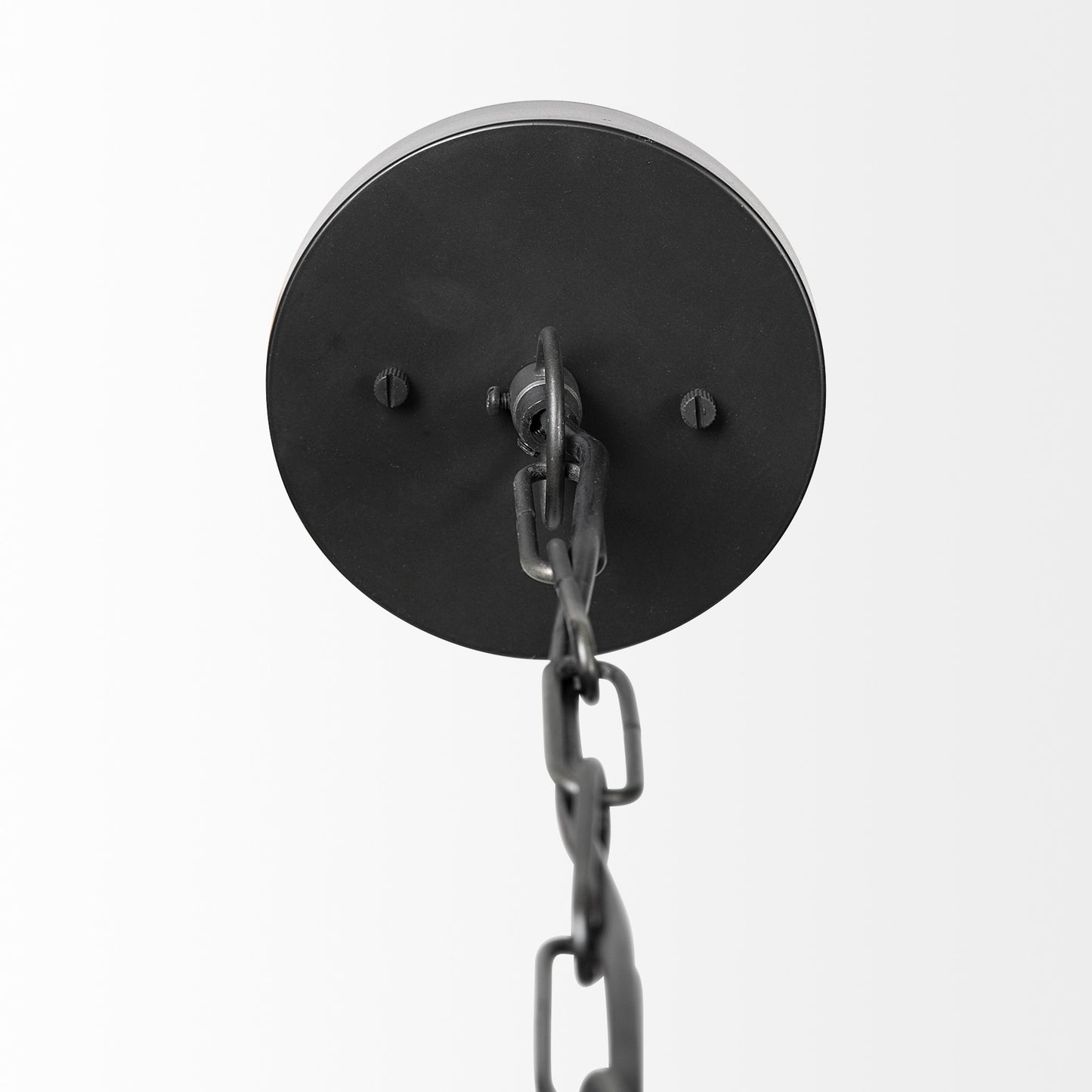 Black metal wall sconce with chain on a white background