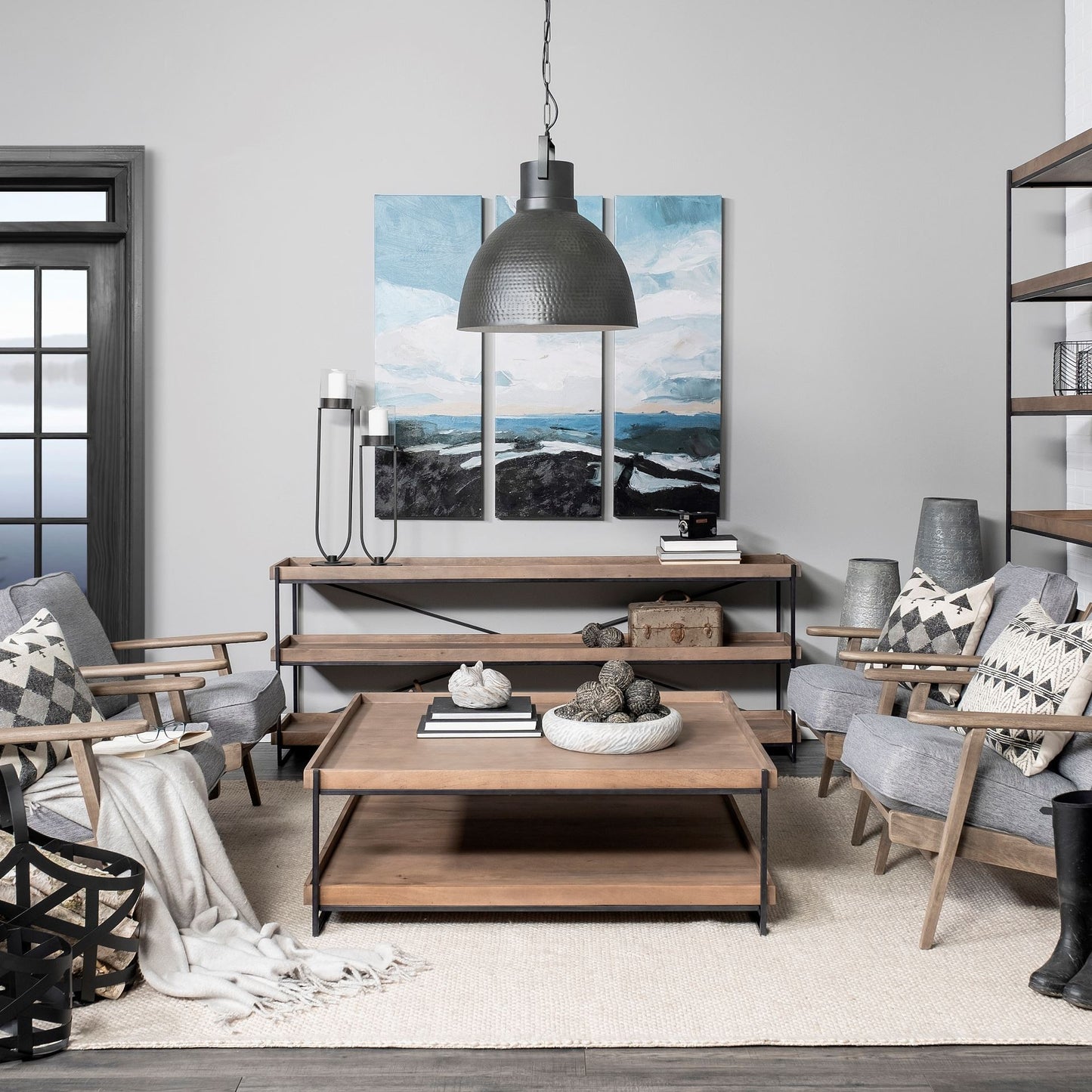 Modern living room with wooden furniture, gray chairs, and decorative items.