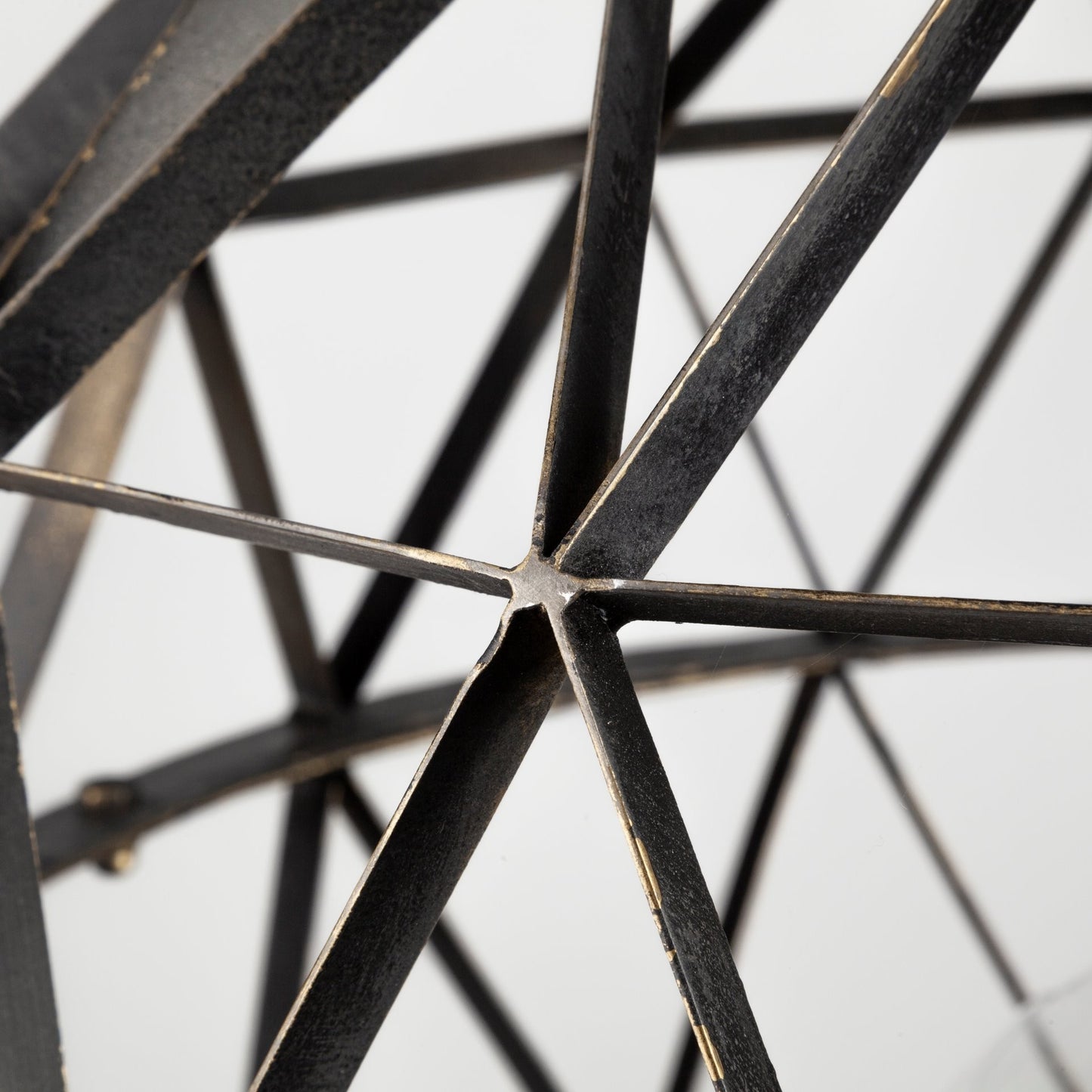Close-up of a metal star-shaped object on a light background