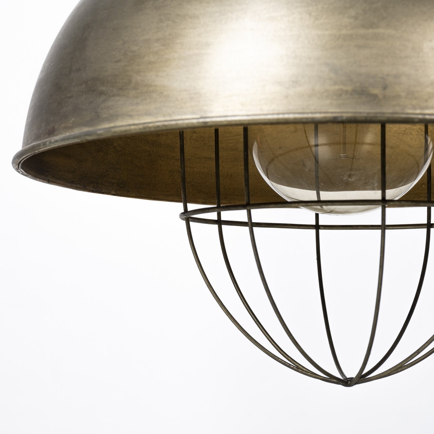 Close-up of a metallic pendant light with a white bulb on a white background