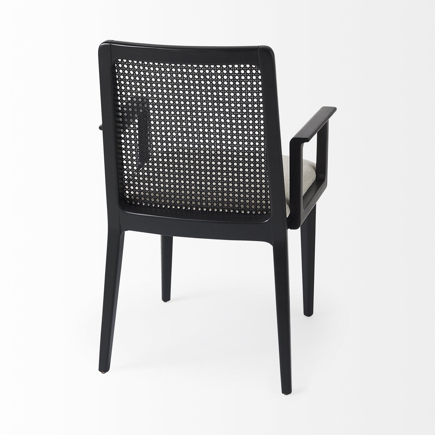 Black chair with woven backrest on a white background