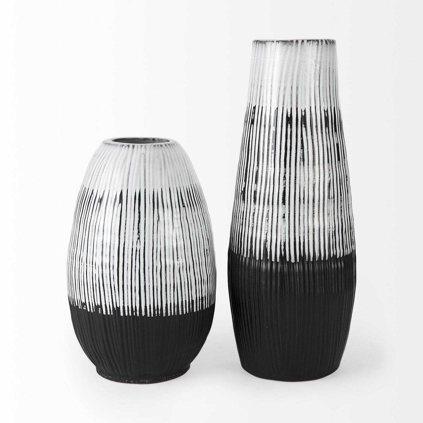 Two black and white patterned vases on a white background