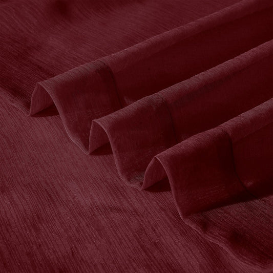 Close-up of maroon fabric with folds