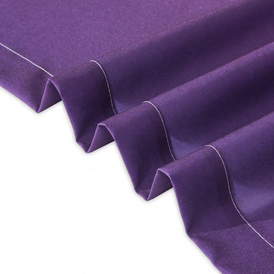 Close-up of purple fabric with a white border on a white background