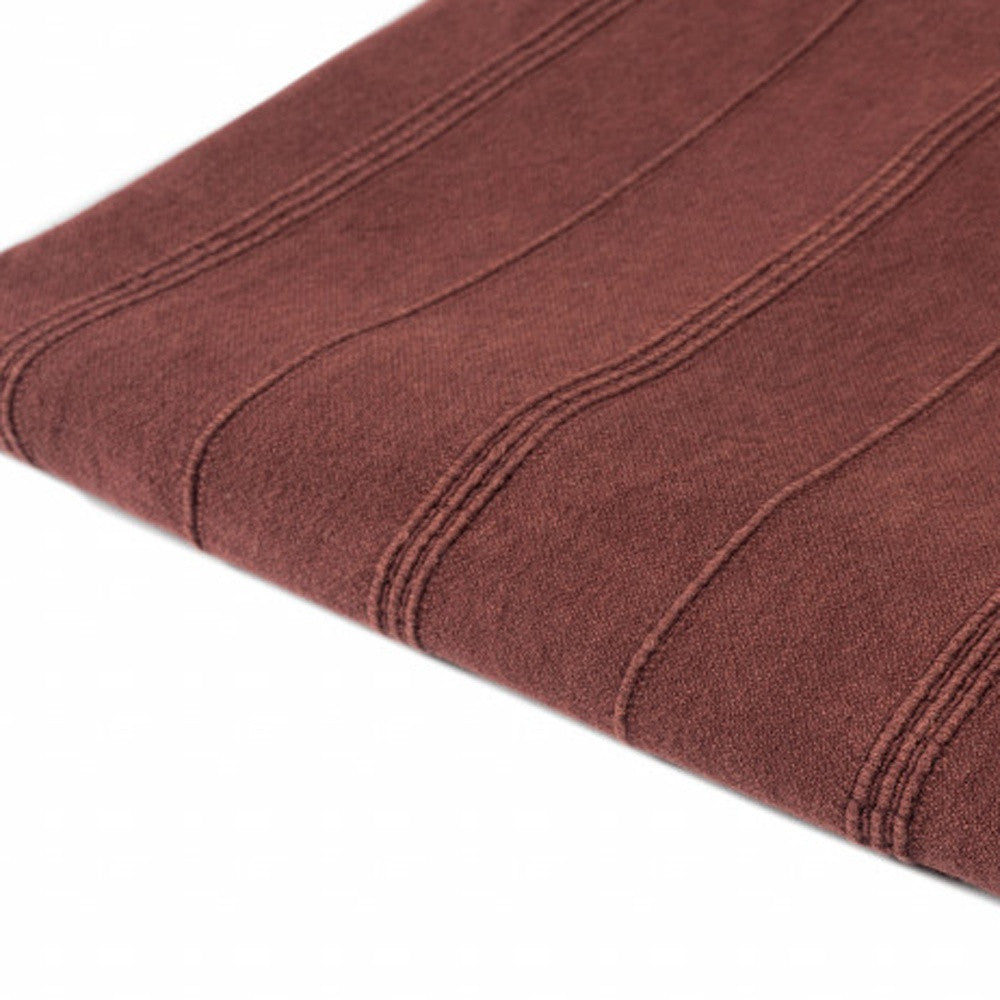 Brown fabric with textured pattern on a white background