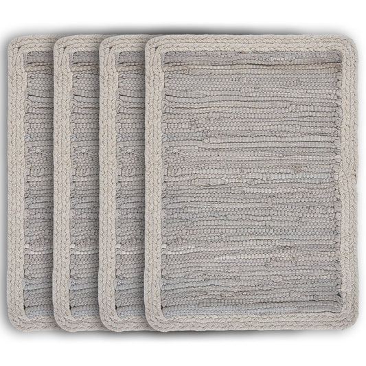 Set of four textured gray bath mats on a white background