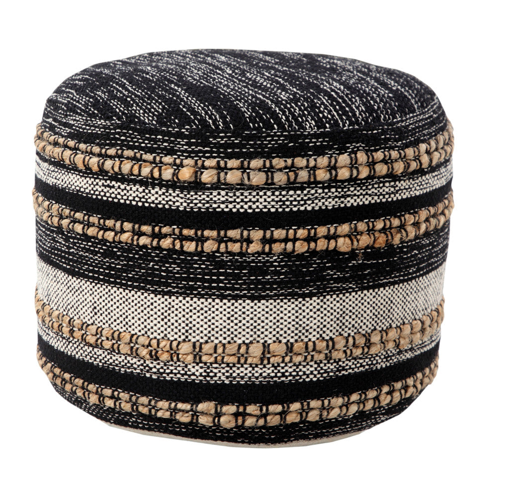 Round woven ottoman with black, beige, and white stripes on a white background