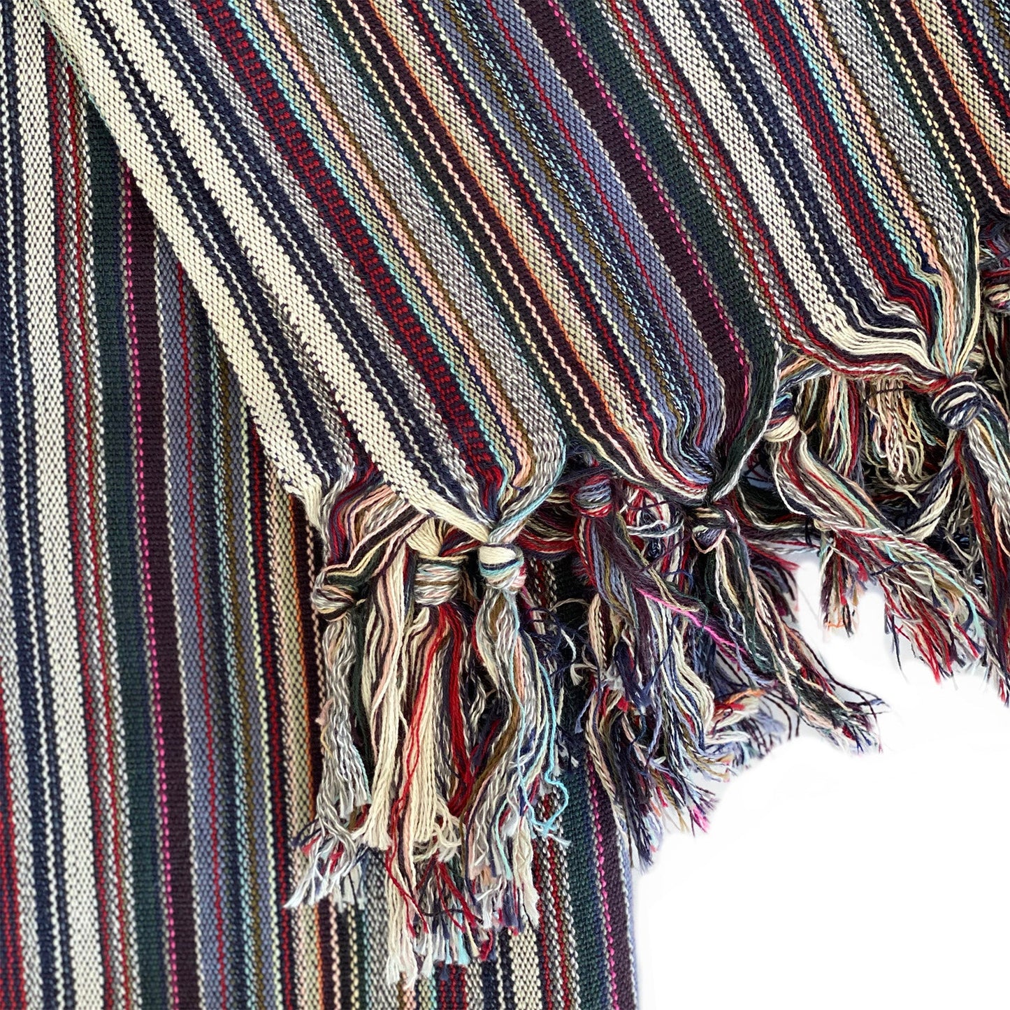 Striped fabric with tassels on a white background