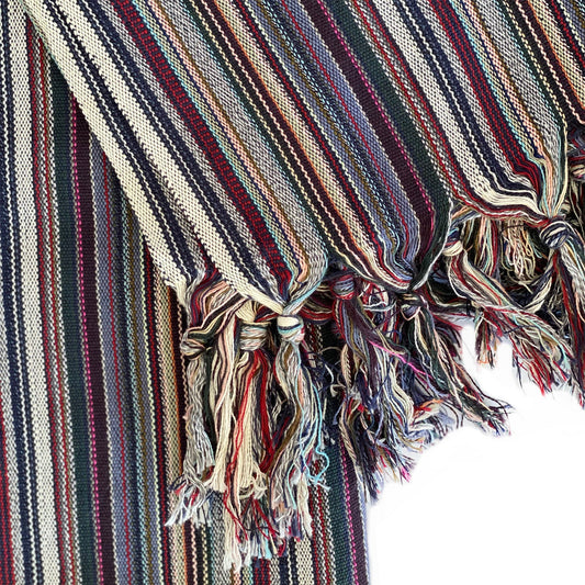 Striped fabric with tassels on a white background