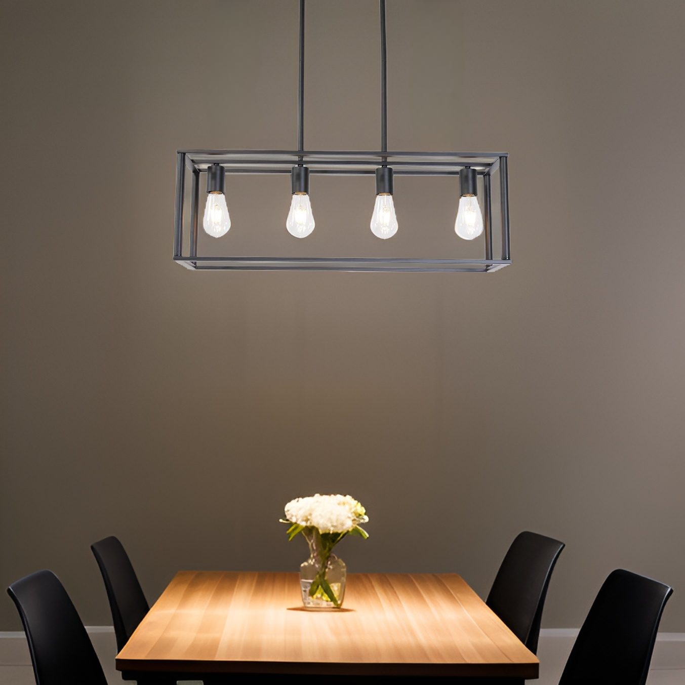 Modern chandelier hanging above a dining table with a vase of flowers on a gray background