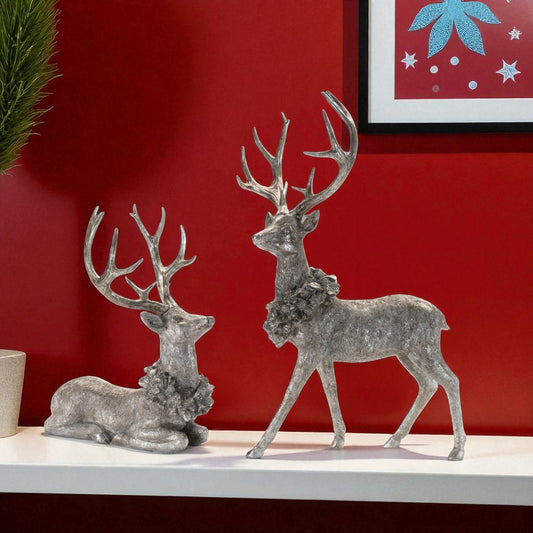 SET OF TWO SILVER AND BLACK REINDEER FIGURINES