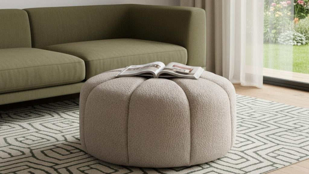 Olive green sectional sofa with cream boucle pouf and warm geometric rug from the Palisades fall collection