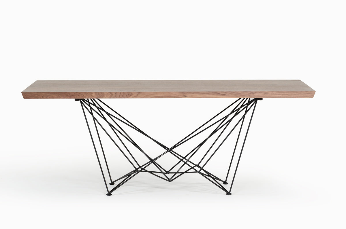 Modern dining table with wooden top and geometric metal base on a white background