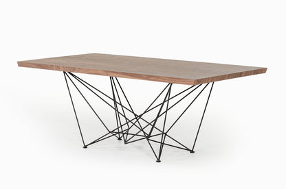 Modern dining table with wooden top and geometric metal legs on a white background