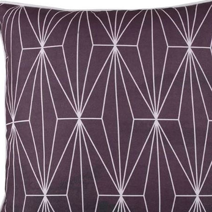 Purple pillow with white geometric pattern