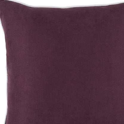Close-up of a purple pillow with a white border