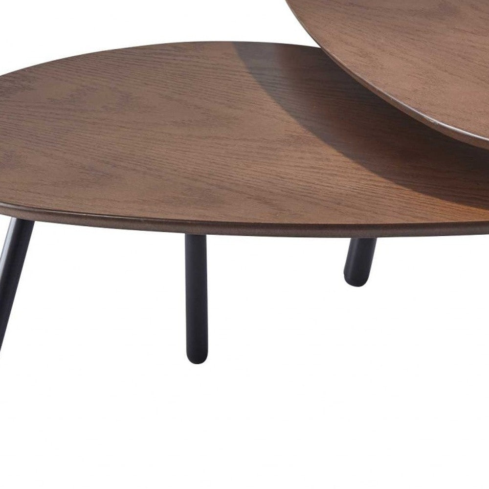 Wooden coffee table with black legs on a white background