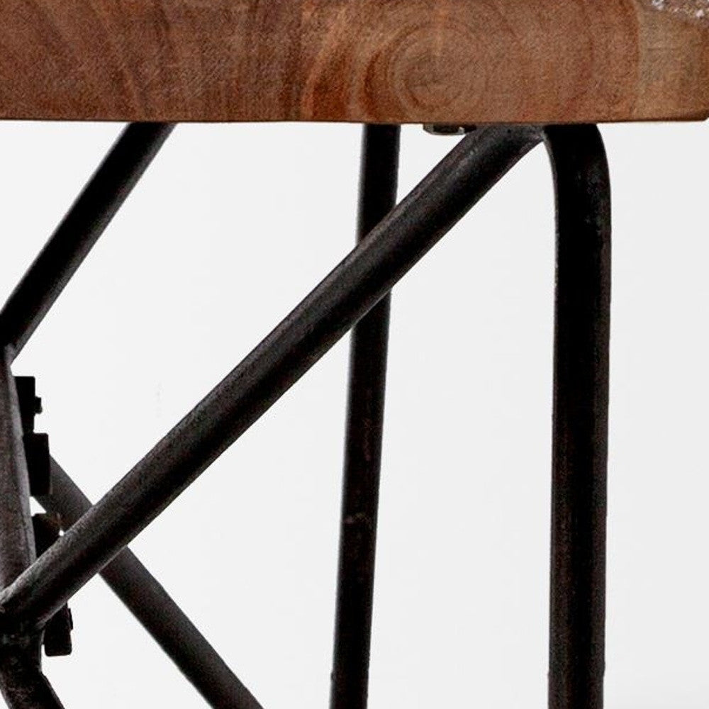 Wooden table top on metal legs with a white background