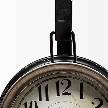 Close-up of a clock with a white face and black numbers on a white background