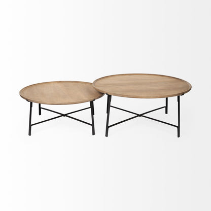 Two round wooden coffee tables with black metal legs on a white background