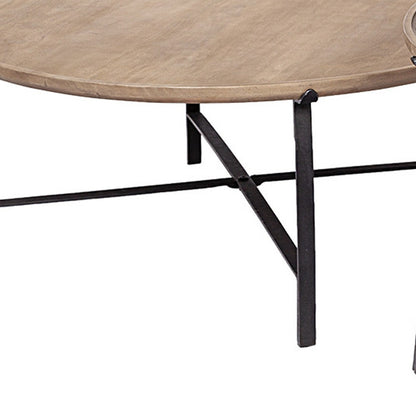 Round wooden table with black metal legs on a white background