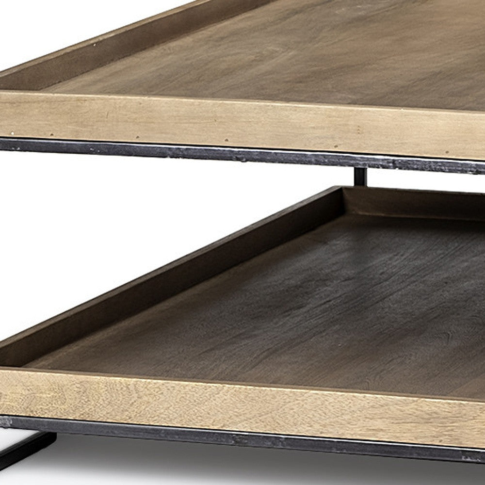 Wooden coffee table with metal accents on a white background
