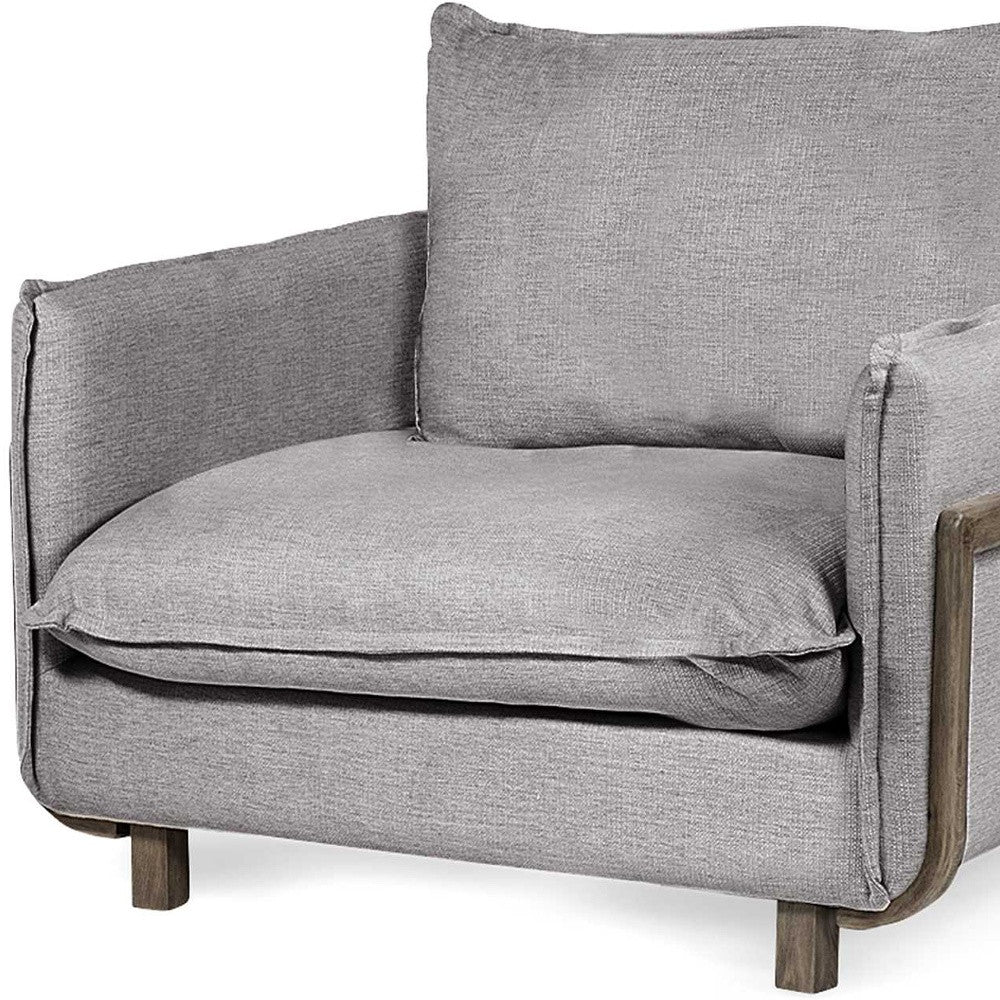 Gray upholstered chair with wooden legs on a white background