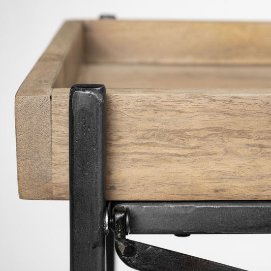 Close-up of a wooden shelf with metal brackets on a white background
