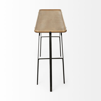 Bar stool with woven seat and black metal legs on a white background