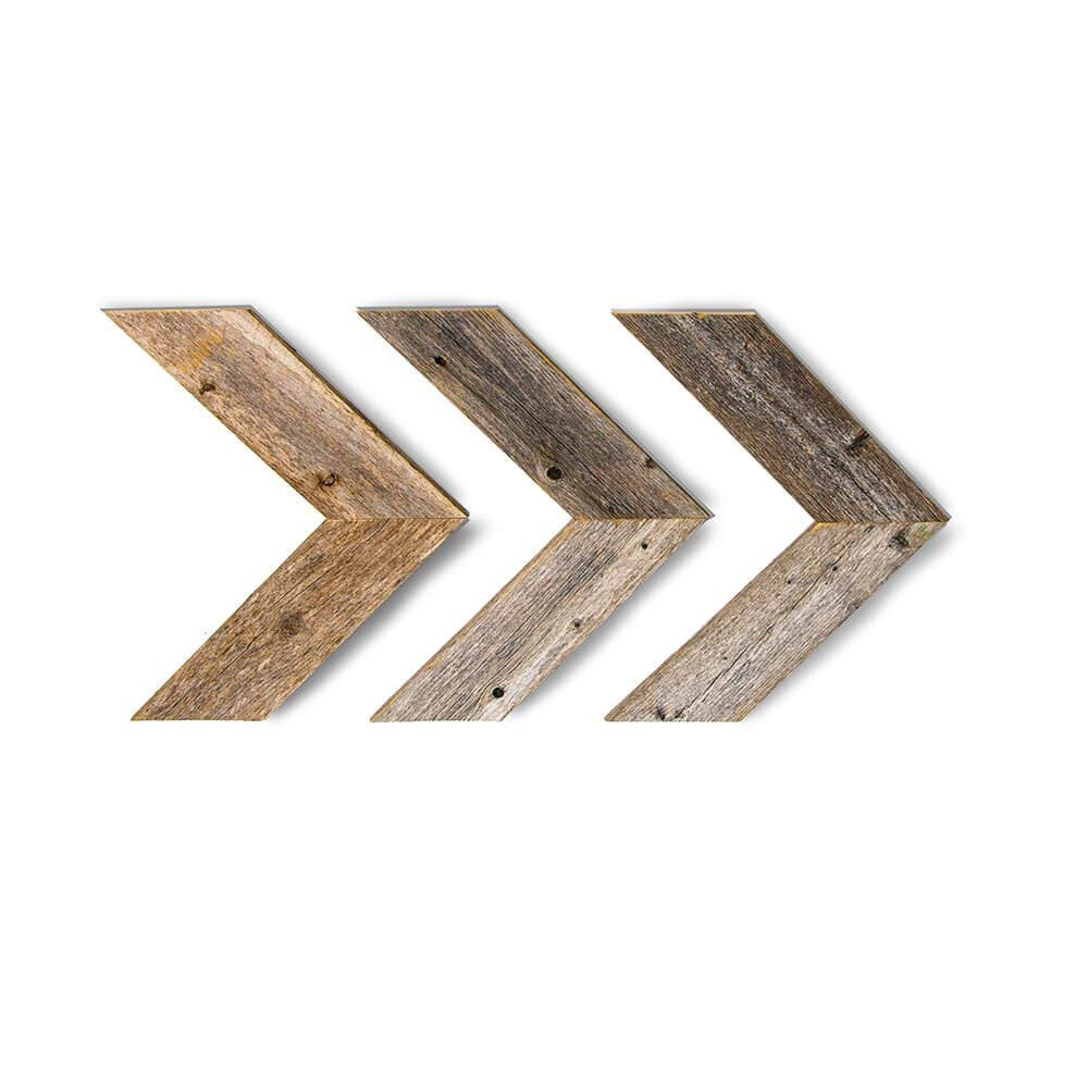Three wooden arrow-shaped wall decor pieces on a white background