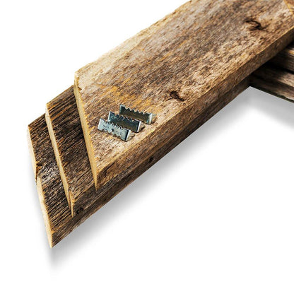 Wooden frame with a metal clip on a white background