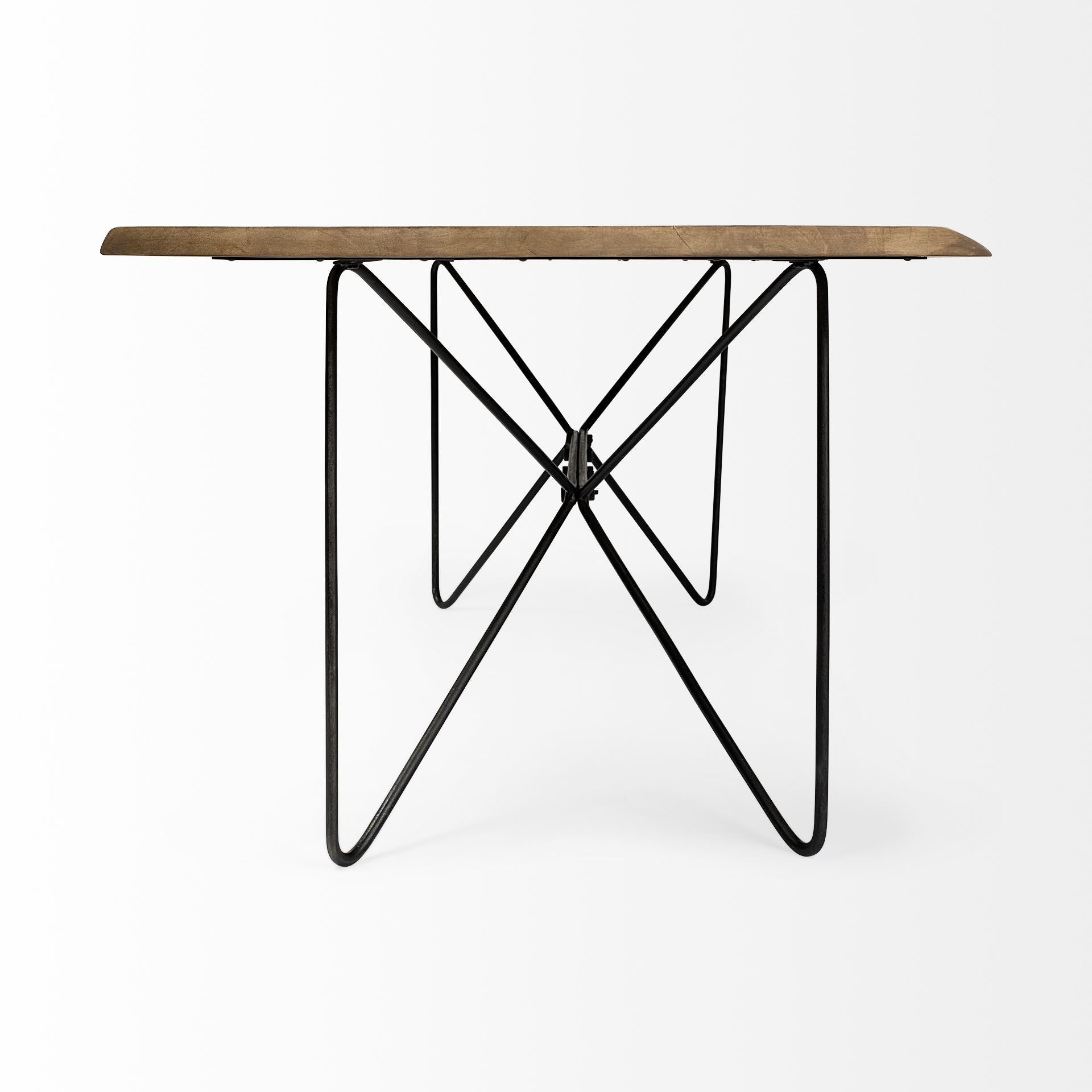 Table with wooden top and black metal legs on a white background