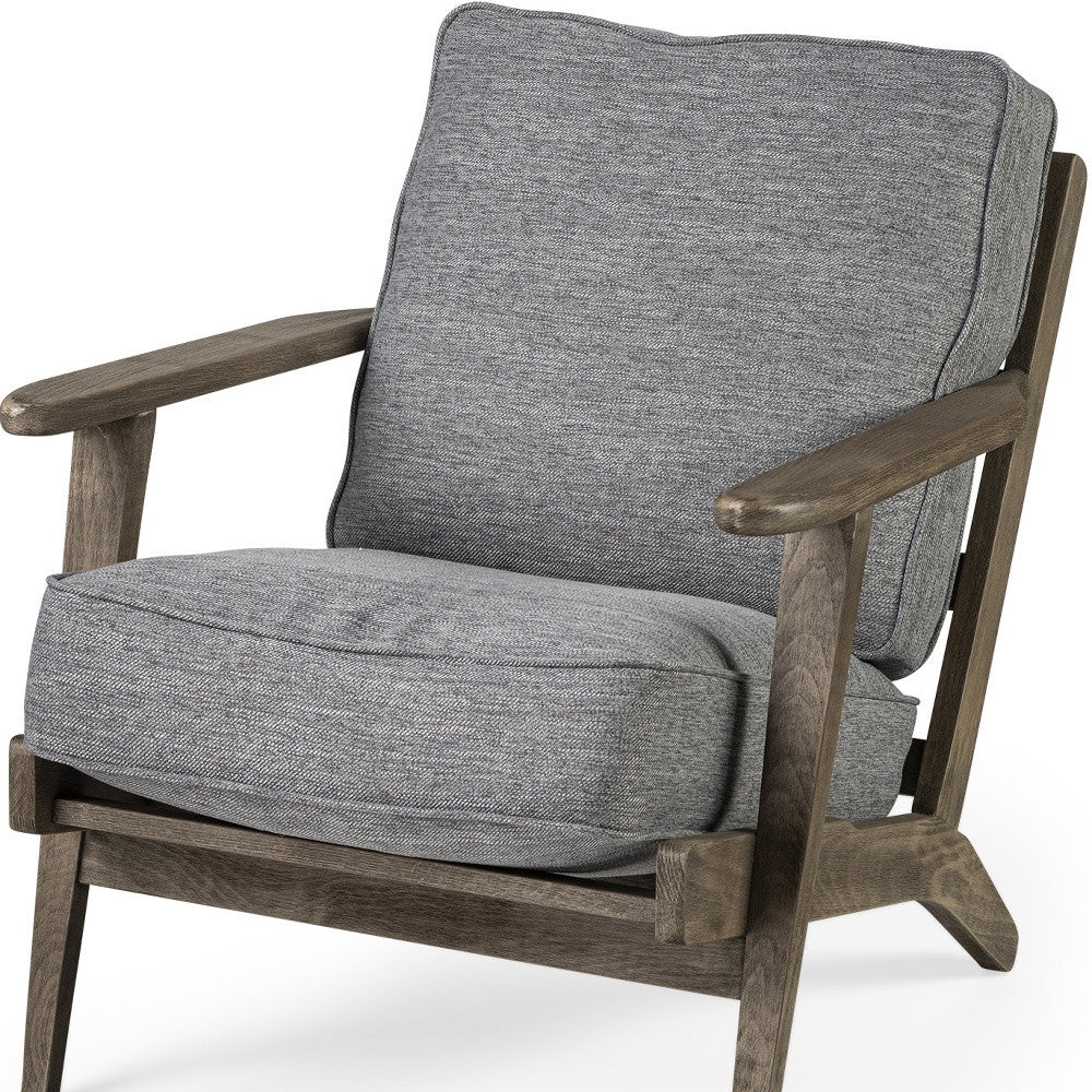 Gray cushioned armchair with wooden frame on a white background