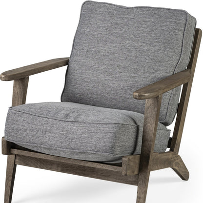 Gray cushioned armchair with wooden frame on a white background