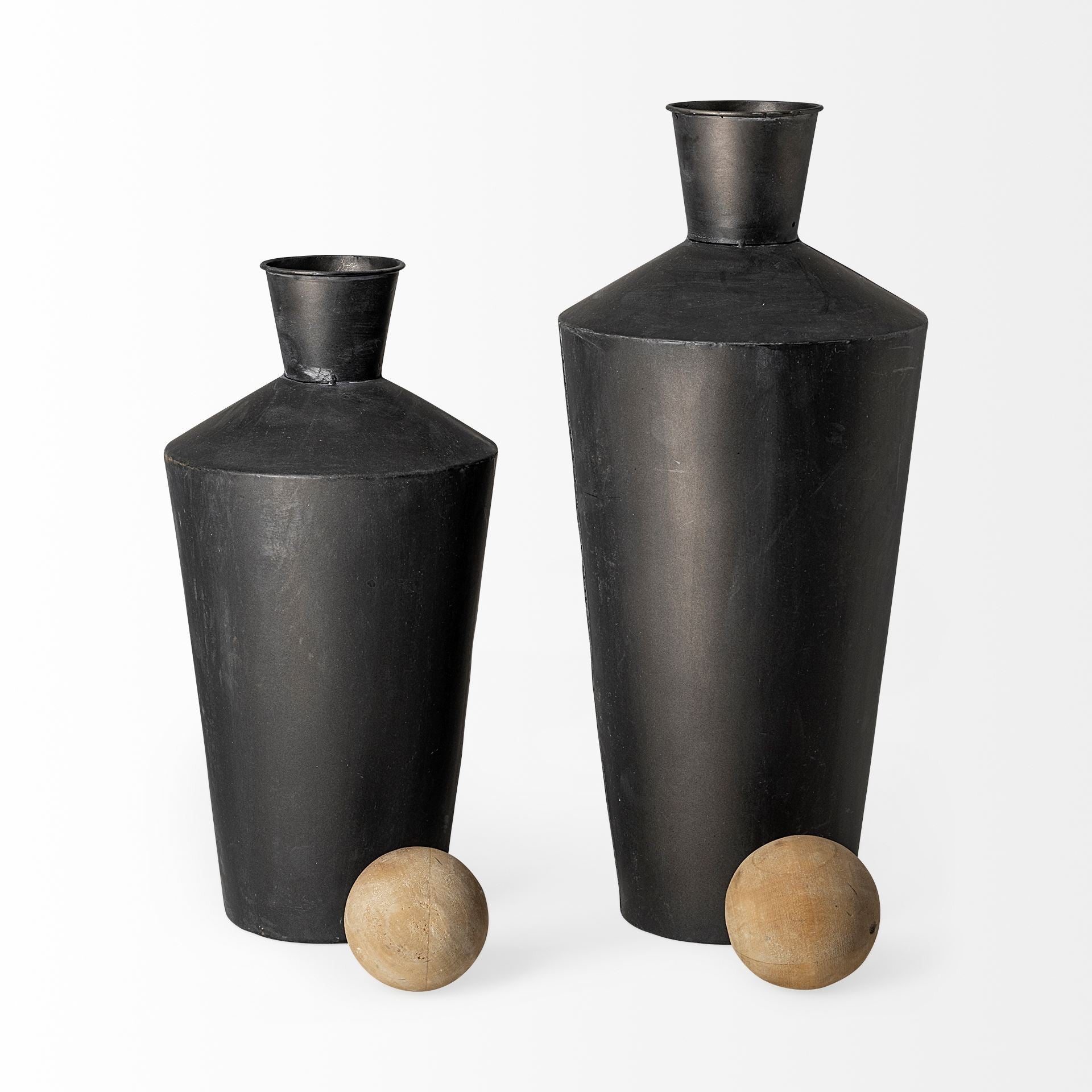 Two black vases on a white background