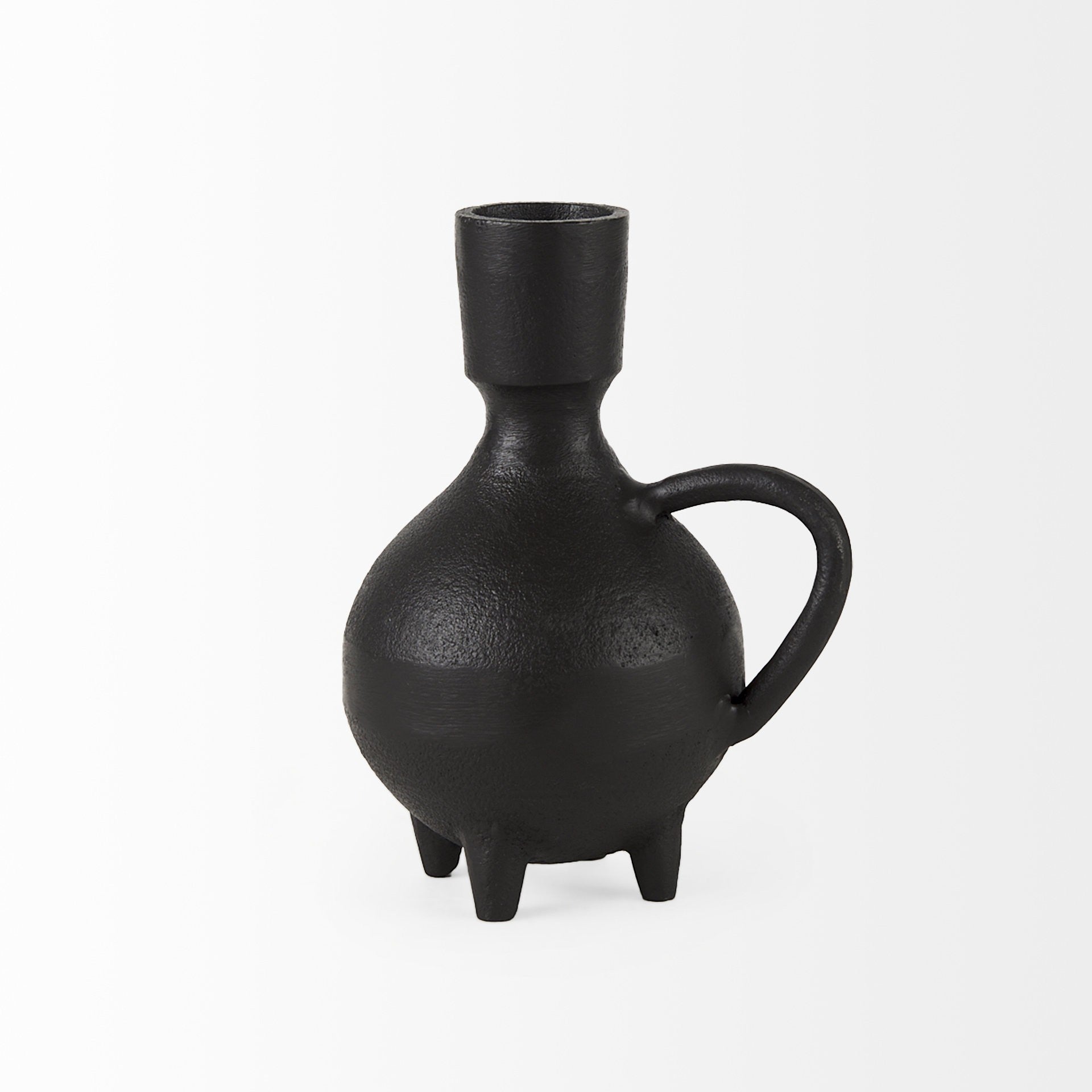 Black ceramic vase with a handle on a white background