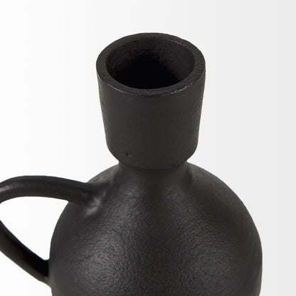 Black ceramic vase with a handle on a white background