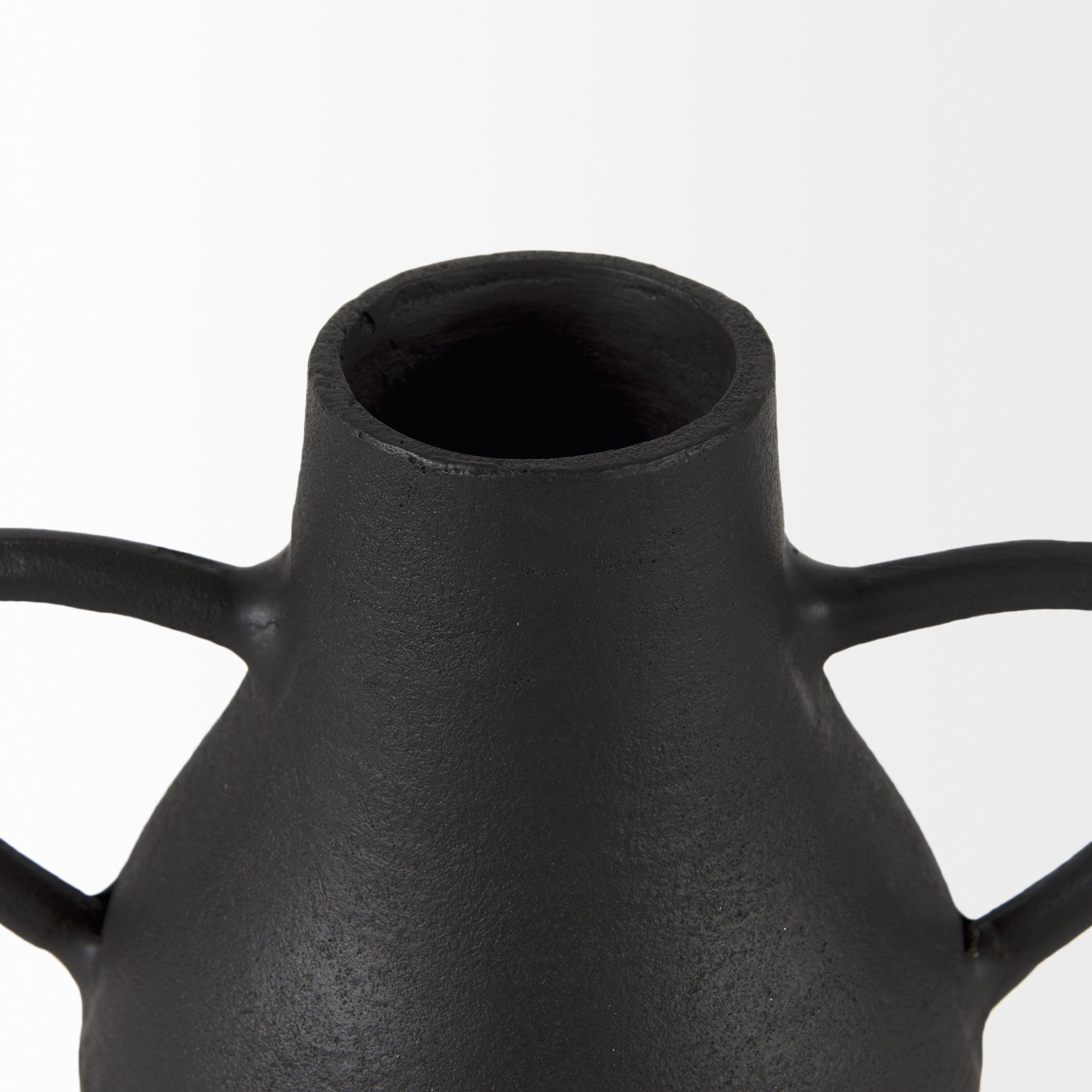 Black ceramic vase with two handles on a white background