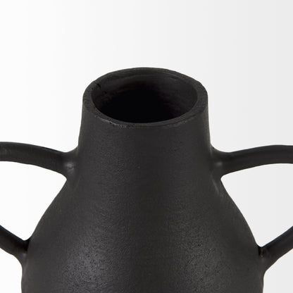 Black ceramic vase with two handles on a white background